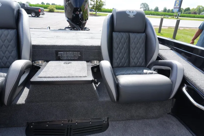 Slide: The Image of 2026 Phoenix 721 ZXL boat interior with plush seating and cup holders. - 12
