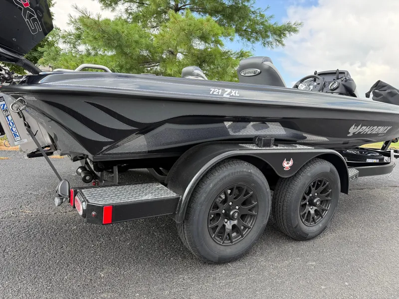 Slide: The Image of 2026 Phoenix 721 ZXL boat on trailer, black design, parked outdoors. - 16