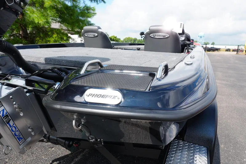 Slide: The Image of 2026 Phoenix 721 ZXL boat, sleek design, parked outdoors, close-up view. - 4
