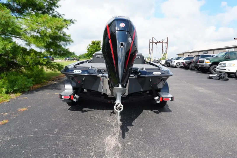 Slide: The Image of 2026 Phoenix 721 ZXL boat with powerful outboard motor on a sunny day. - 5