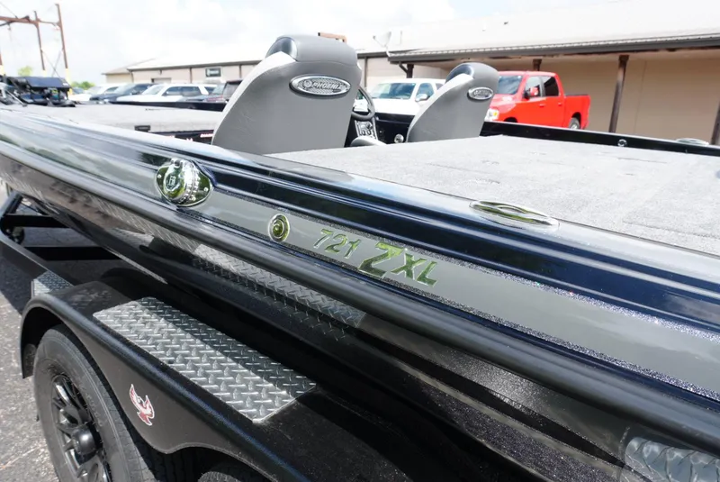 Slide: The Image of 2026 Phoenix 721 ZXL boat, sleek design, parked outdoors, featuring dual seats and modern detailing. - 7
