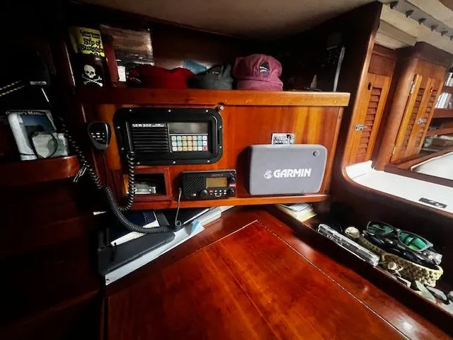 Slide: The Image of Interior of 1990 Bristol 47.7 Cutter/Sloop with navigation equipment and wooden cabinetry. - 10