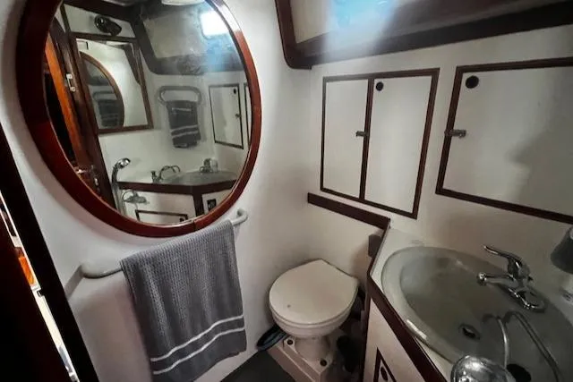Slide: The Image of Bathroom interior of 1990 Bristol 47.7 Cutter/Sloop with sink, toilet, and mirror. - 14