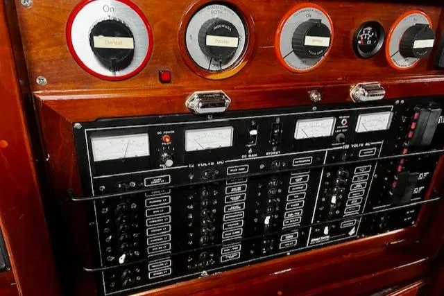 Slide: The Image of Control panel of a 1990 Bristol 47.7 Cutter/Sloop with gauges and switches. - 16