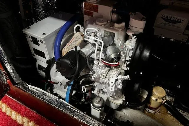 Slide: The Image of Engine compartment of a 1990 Bristol 47.7 Cutter/Sloop, showcasing mechanical components. - 17