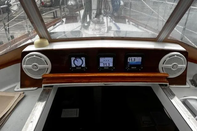 Slide: The Image of Cockpit of 1990 Bristol 47.7 Cutter/Sloop with navigation instruments and speakers. - 18