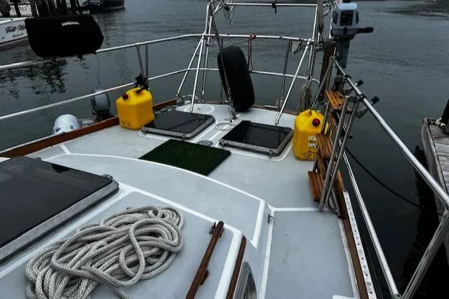 Slide: The Image of Bristol 47.7 Cutter/Sloop 1990 deck with ropes and yellow fuel containers. - 20