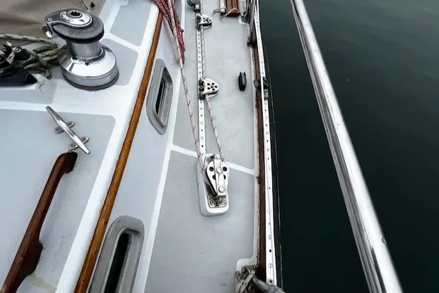 Slide: The Image of Deck view of a 1990 Bristol 47.7 Cutter/Sloop sailboat with winch and rigging. - 22