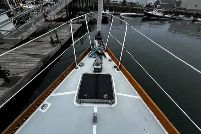 Slide: The Image of Bow view of 1990 Bristol 47.7 Cutter/Sloop docked at a marina. - 27