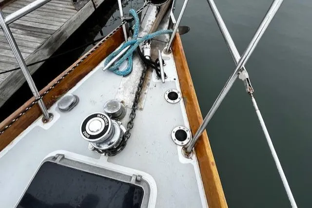 Slide: The Image of Bristol 47.7 Cutter/Sloop 1990 deck with winch and ropes at dockside. - 28
