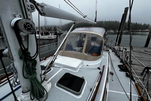 Slide: The Image of Sailboat docked in a marina, Bristol 47.7 Cutter/Sloop, 1990 model, overcast weather. - 31