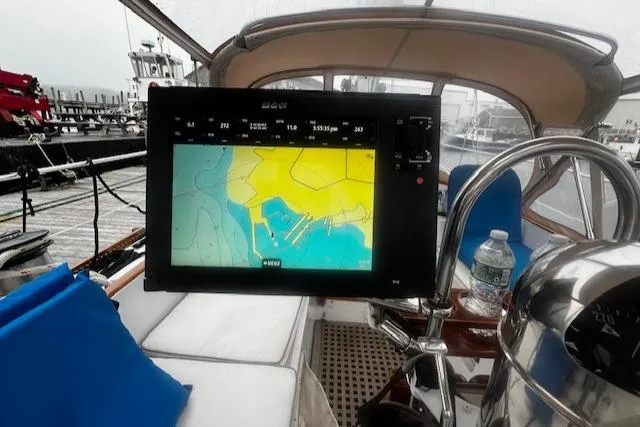 Slide: The Image of Navigation system on a 1990 Bristol 47.7 Cutter/Sloop sailboat, docked with visible marina. - 36