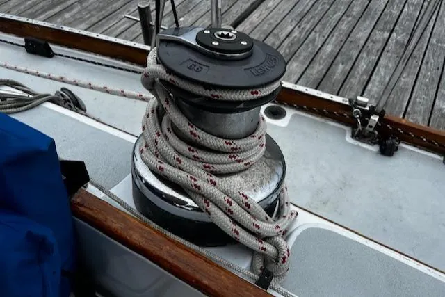 Slide: The Image of Bristol 47.7 Cutter/Sloop, 1990, docked with rigging and fender visible. - 41