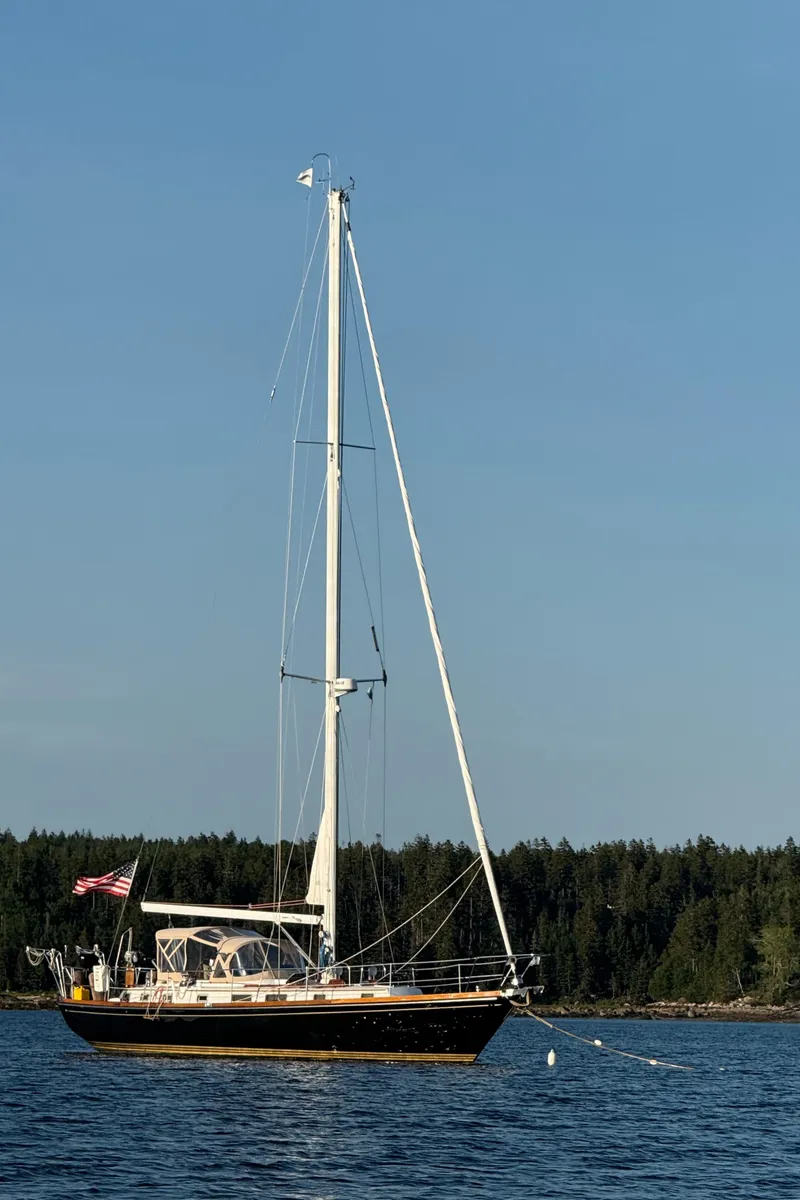 Slide: The Image of Sailing on a 1990 Bristol 47.7 Cutter/Sloop with American flag, clear skies. - 43