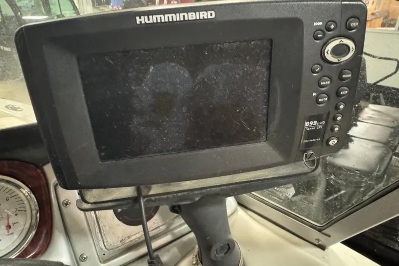 Slide: The Image of Humminbird sonar GPS device on 2011 Nitro 290 Sport boat dashboard. - 13