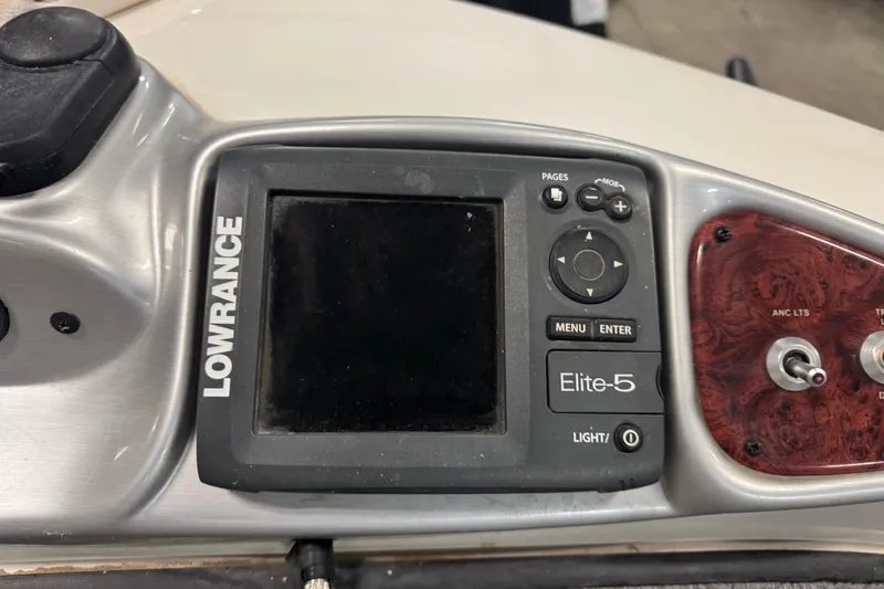Slide: The Image of Lowrance Elite-5 fishfinder on 2011 Nitro 290 Sport boat dashboard. - 18