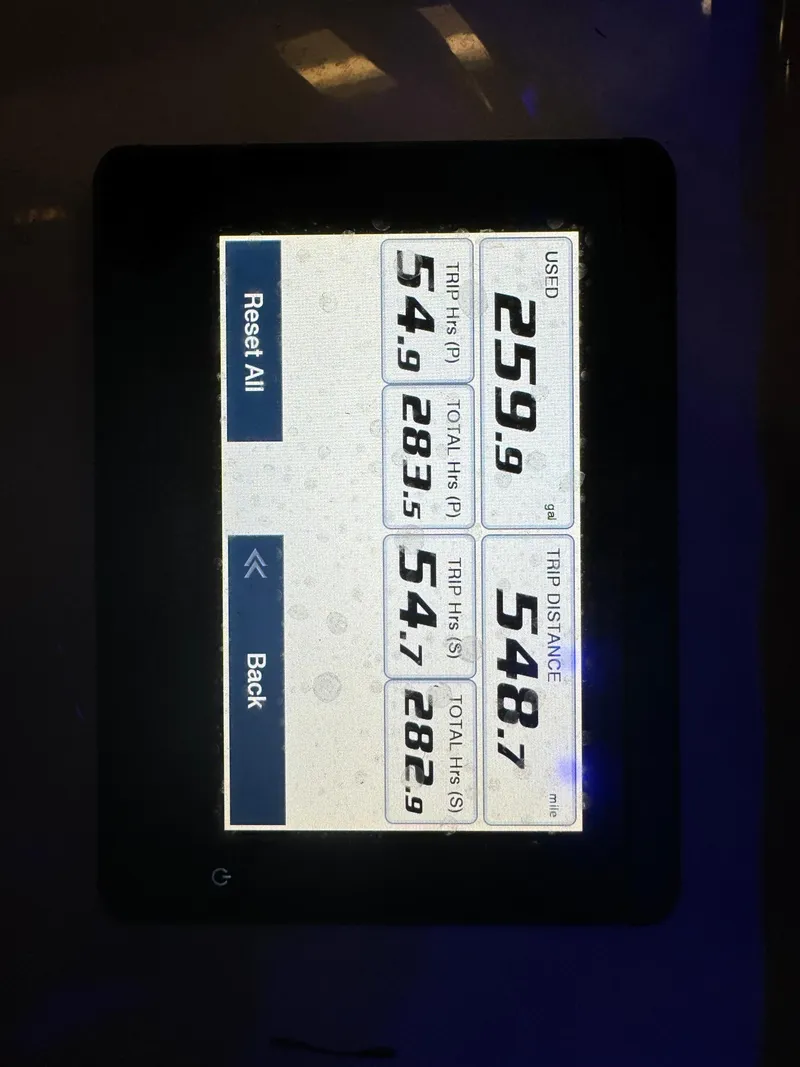 Slide: The Image of Digital display on a 2021 Sea Hunt Gamefish 27 boat showing trip data. - 10