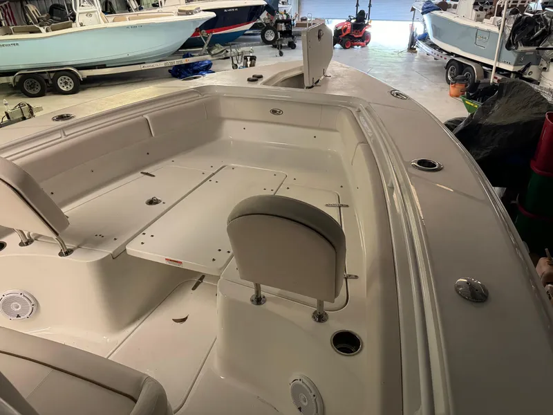 Slide: The Image of 2021 Sea Hunt Gamefish 27 boat interior in a showroom. - 5
