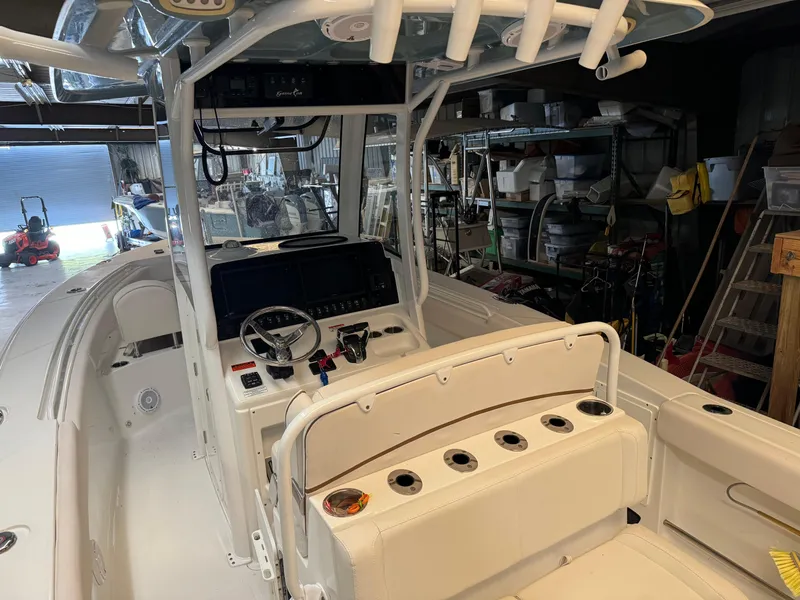 Slide: The Image of 2021 Sea Hunt Gamefish 27 boat interior with helm and seating. - 8