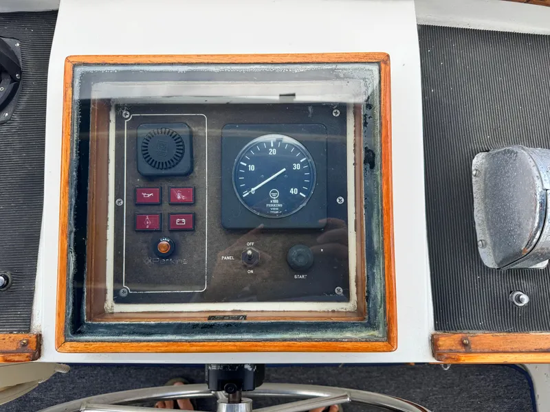 Slide: The Image of 1983 Rough Water Flybridge control panel with gauges and switches. - 18