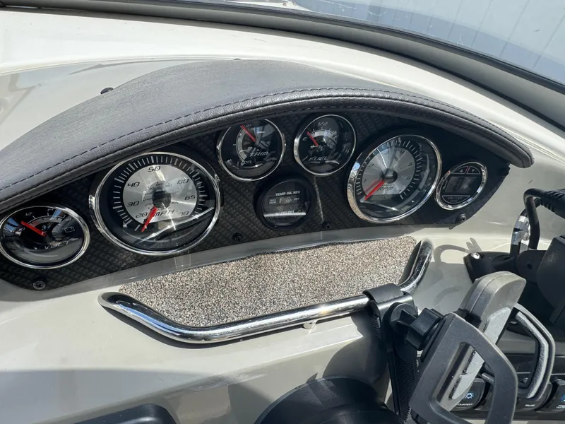 Slide: The Image of Dashboard of a 2018 Stingray 234 LR boat with gauges and controls. - 9