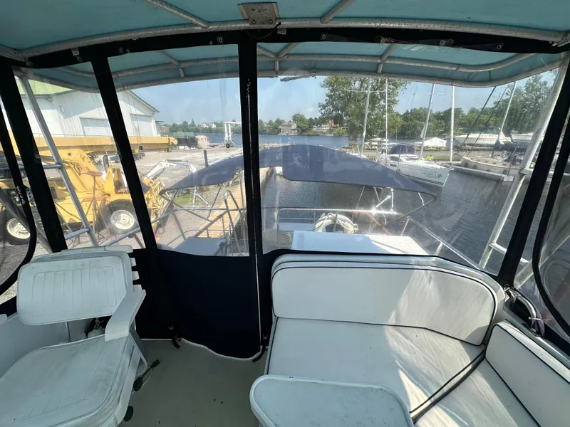 Slide: The Image of 1996 Island Gypsy 36 Aft Cabin interior view with marina backdrop. - 12