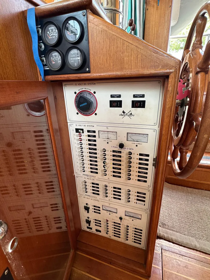 Slide: The Image of Electrical control panel on a 1996 Island Gypsy 36 Aft Cabin boat. - 19