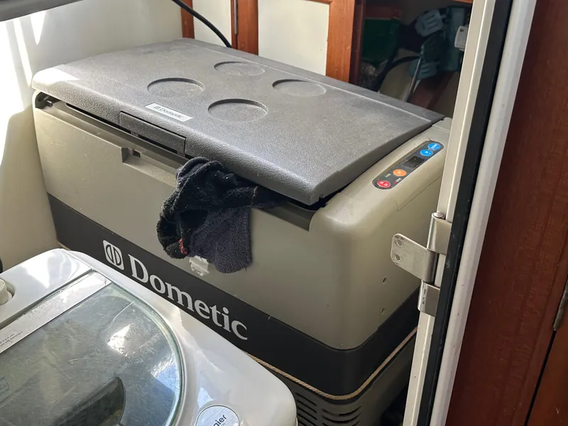 Slide: The Image of Dometic cooler inside 1996 Island Gypsy 36 Aft Cabin boat. - 32