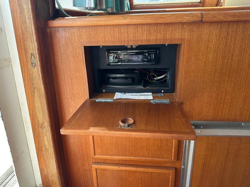 Slide: The Image of 1996 Island Gypsy 36 Aft Cabin interior with Kenwood stereo system in wooden panel. - 34