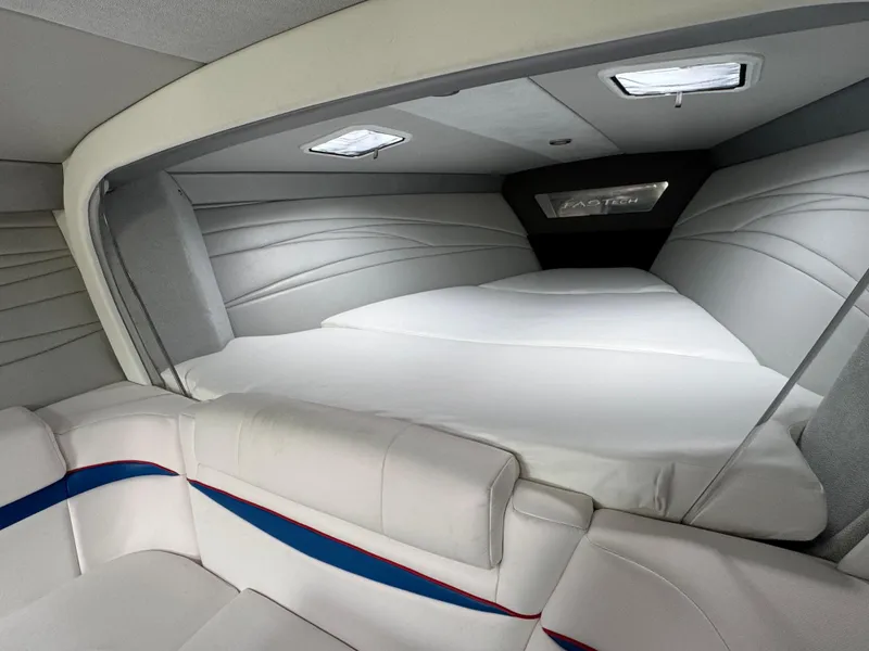 Slide: The Image of Interior of 2020 Formula 382 FASTech boat, featuring sleek white and blue seating. - 25