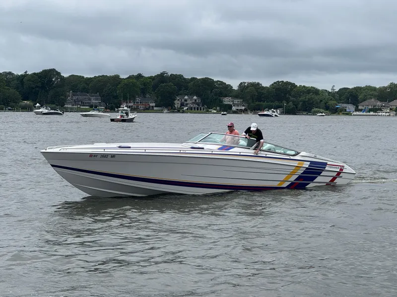 Slide: The Image of 2020 Formula 382 FASTech boat cruising on a lake with passengers onboard. - 3