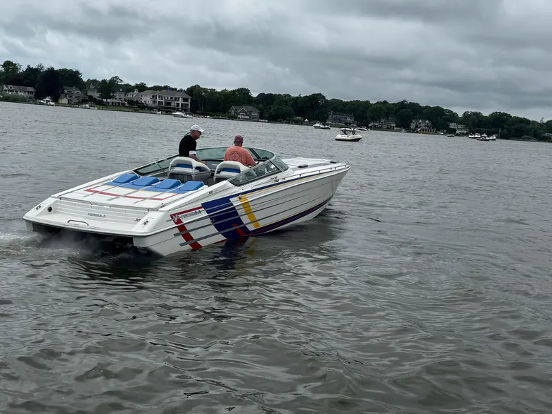 Slide: The Image of 2020 Formula 382 FASTech speedboat cruising on a cloudy day in a scenic waterway. - 4
