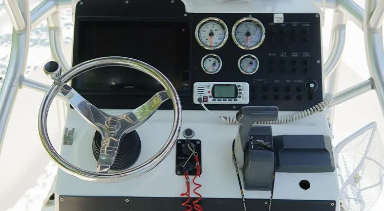 Slide: The Image of Control panel of 2012 Tidewater 2200 Carolina Bay boat with steering wheel and gauges. - 12