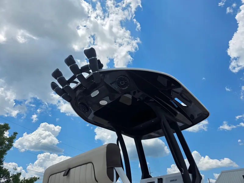 Slide: The Image of 2025 Yamaha Boats 222 FSH Sport E T-top against a bright blue sky. - 12