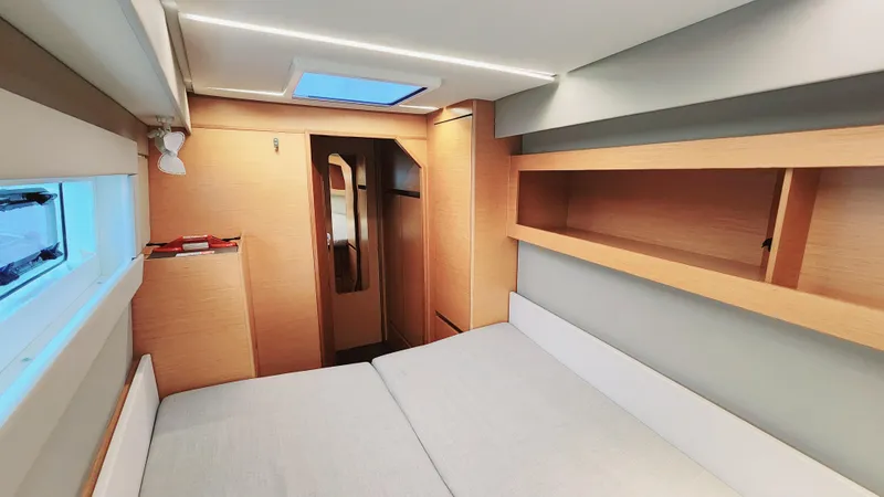 Slide: The Image of Interior of 2017 Nautitech 46 Fly catamaran, featuring modern wood finishes and spacious cabin design. - 15