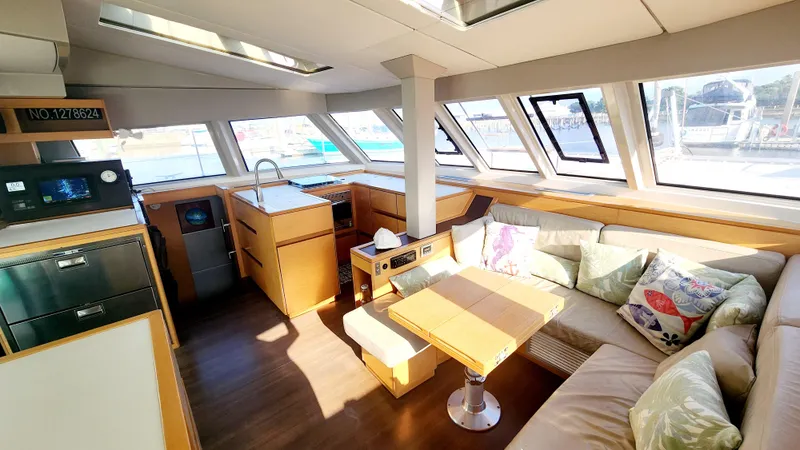 Slide: The Image of Luxurious interior of 2017 Nautitech 46 Fly catamaran with modern kitchen and cozy seating area. - 2
