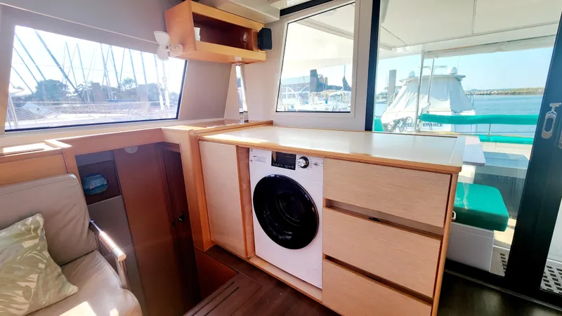Slide: The Image of Interior of 2017 Nautitech 46 Fly yacht with washing machine and marina view. - 21