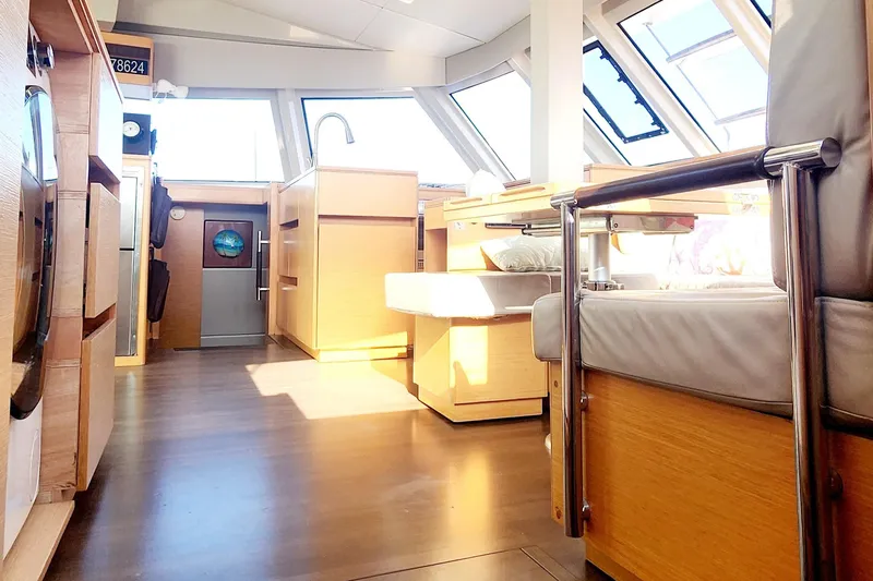 Slide: The Image of Interior of 2017 Nautitech 46 Fly catamaran, featuring modern wood finishes and ample natural light. - 3