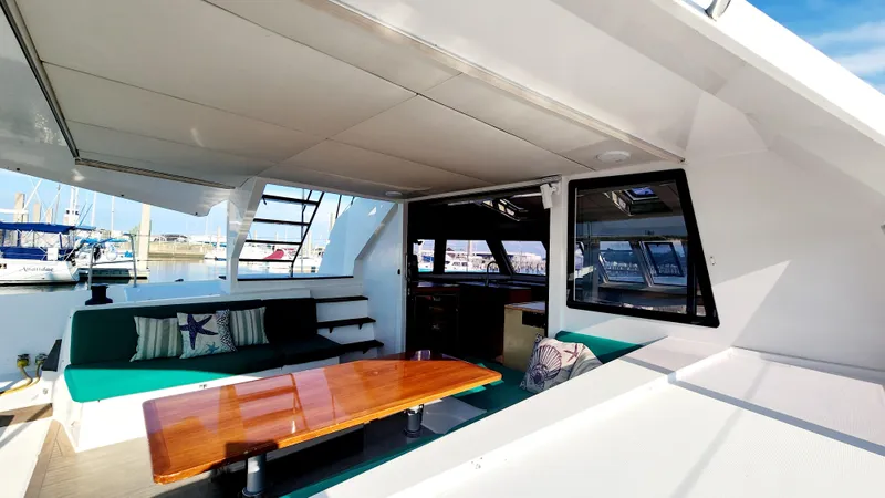 Slide: The Image of Spacious interior of 2017 Nautitech 46 Fly catamaran with comfortable seating and wooden table. - 30