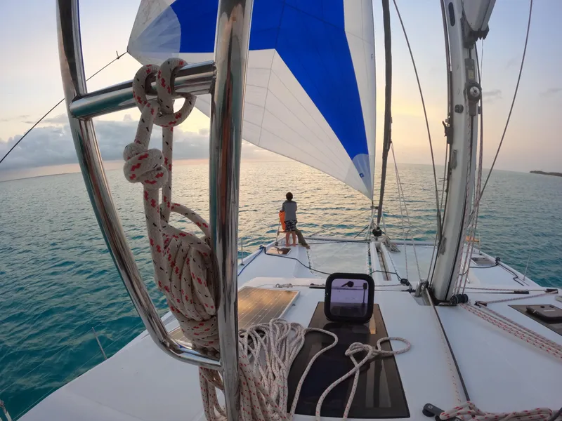 Slide: The Image of Sailing on a 2017 Nautitech 46 Fly catamaran at sunset, with a person enjoying the view. - 36