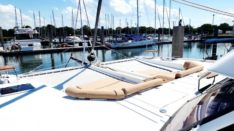 Slide: The Image of Nautitech 46 Fly 2017 catamaran with sun loungers docked at marina. - 37