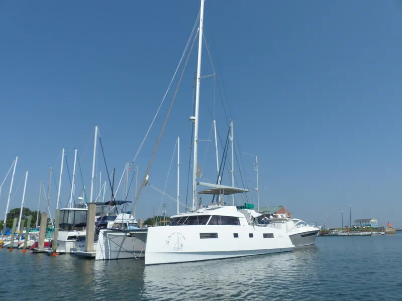 Slide: The Image of Nautitech 46 Fly 2017 catamaran docked in a marina under clear blue skies. - 45