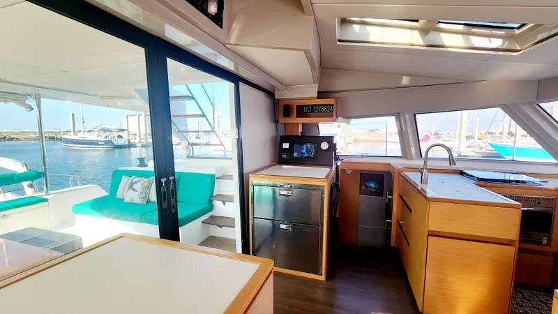 Slide: The Image of Interior of 2017 Nautitech 46 Fly catamaran with modern kitchen and outdoor seating. - 7