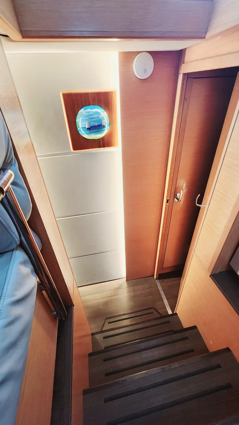 Slide: The Image of Interior of 2017 Nautitech 46 Fly yacht, featuring wooden stairs and modern design. - 8