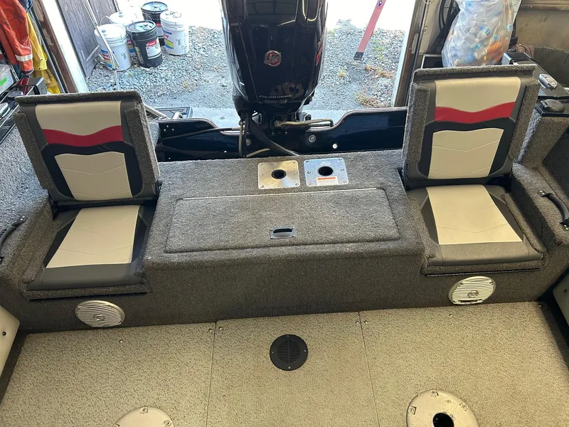 Slide: The Image of 2017 Lowe Fish & Ski FS1710 boat interior with seating and storage compartments. - 3