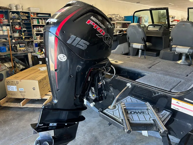Slide: The Image of 2017 Lowe Fish & Ski FS1710 with Mercury Pro XS 115 engine in a workshop setting. - 8