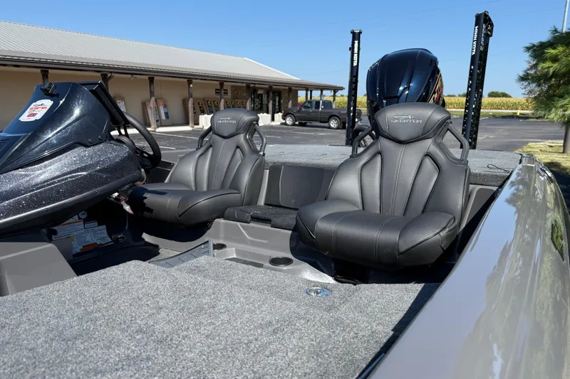 Slide: The Image of 2025 Skeeter ZXR21 boat interior with sleek black seats and modern design. - 15