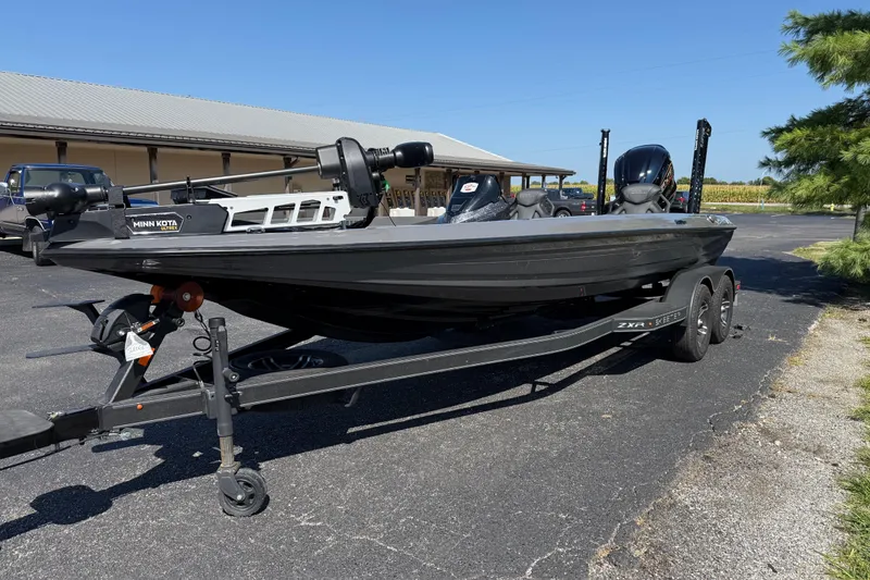 Slide: The Image of 2025 Skeeter ZXR21 fishing boat on trailer, featuring Minn Kota trolling motor. - 8