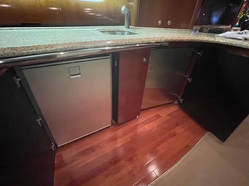 Slide: The Image of Luxurious kitchen area in 2005 Sea Ray 500 Sundancer yacht with wood flooring. - 13