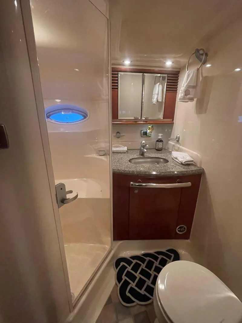 Slide: The Image of Luxurious bathroom in 2005 Sea Ray 500 Sundancer yacht with modern amenities. - 14